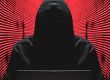 Ransomware report graphic: cyber criminal at a computer terminal